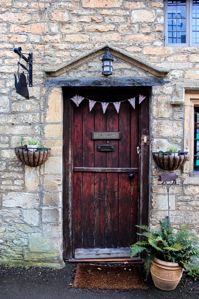 Door with bunting in Castle Combe