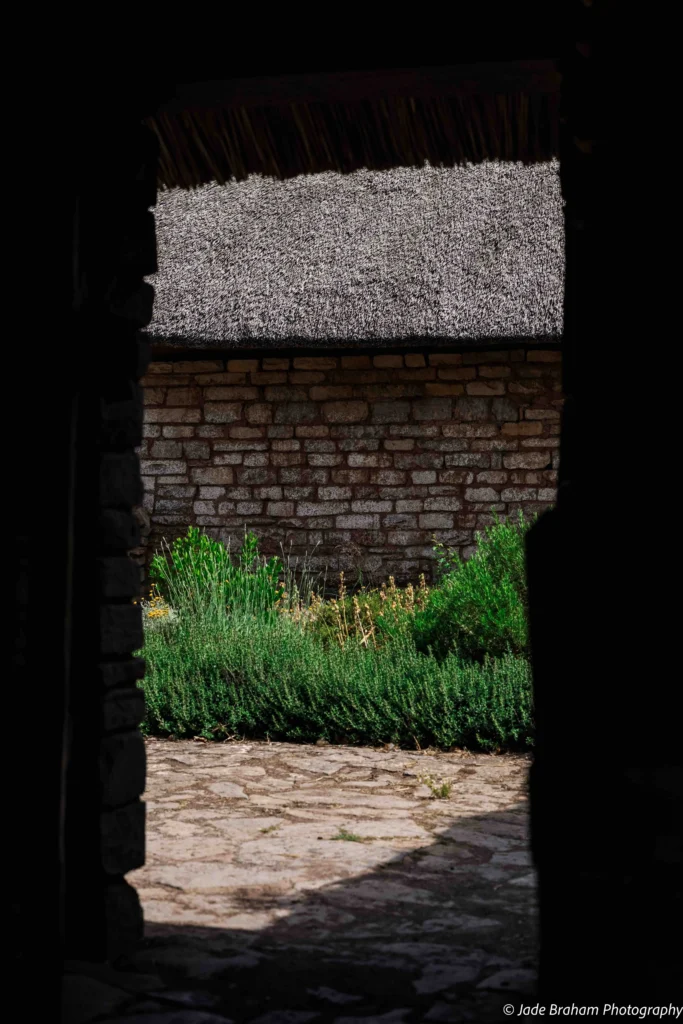 There are courtyards at the back of the barn at Cosmeston Medieval Village.