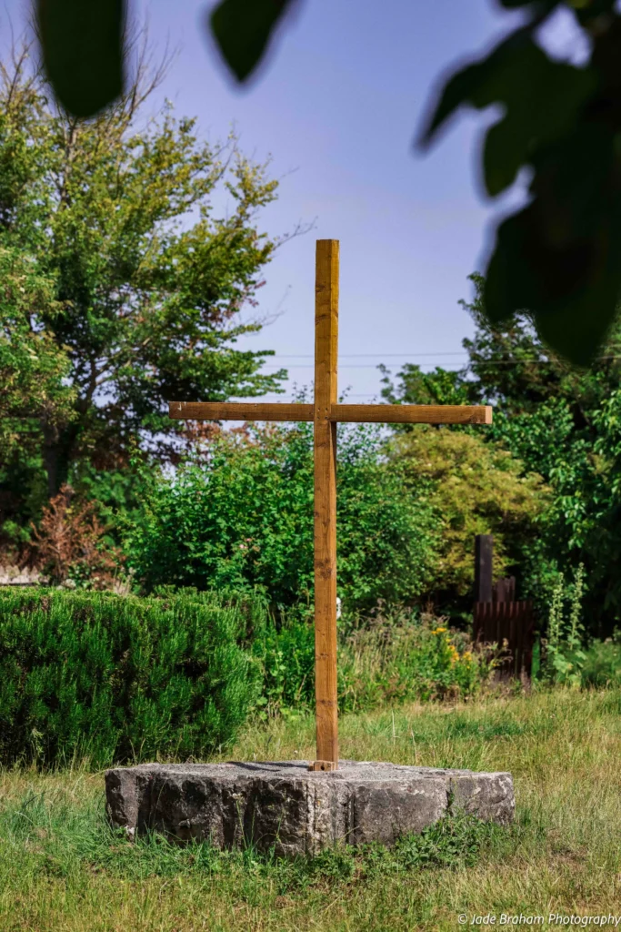 There is a cross in the square of Cosmeston Medieval Village.