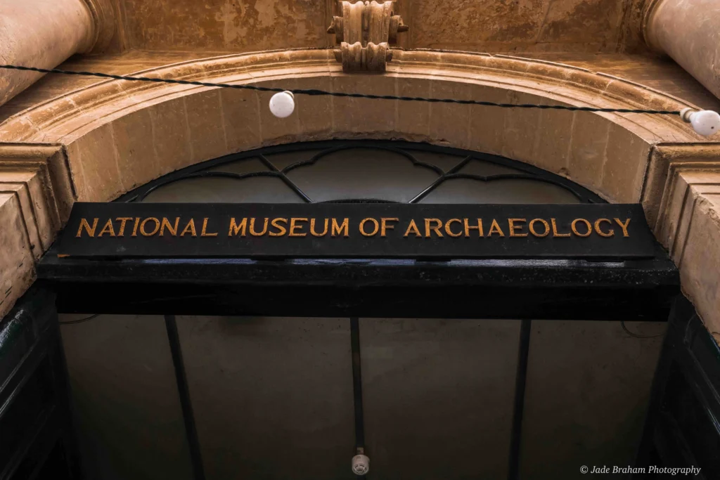 National Museum of Archaeology has a sign with its title over the entrance door. 