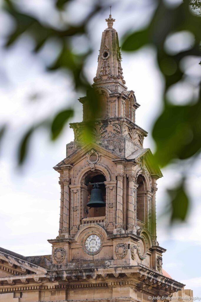St. Publius Parish Church has magnificent, ornate carvings and a bell tower.