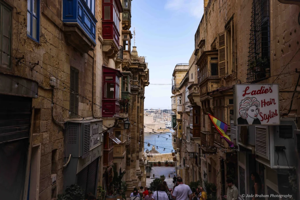 There are many narrow streets in Valletta with colourful balconies and ocean views. 