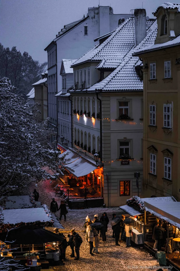 Prague Christmas Market stalls are set amongst the city's narrow streets. 