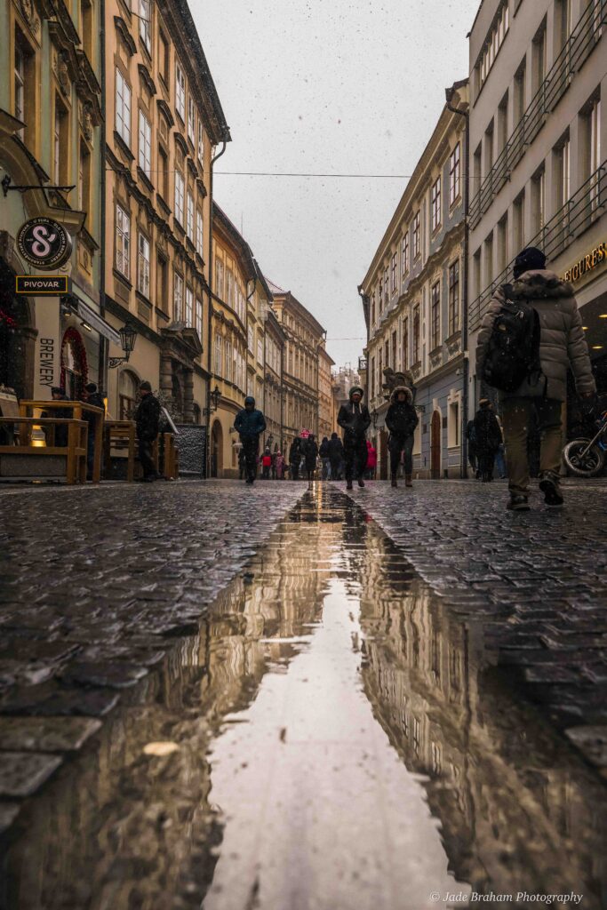 Prague highstreet is full of people shopping.