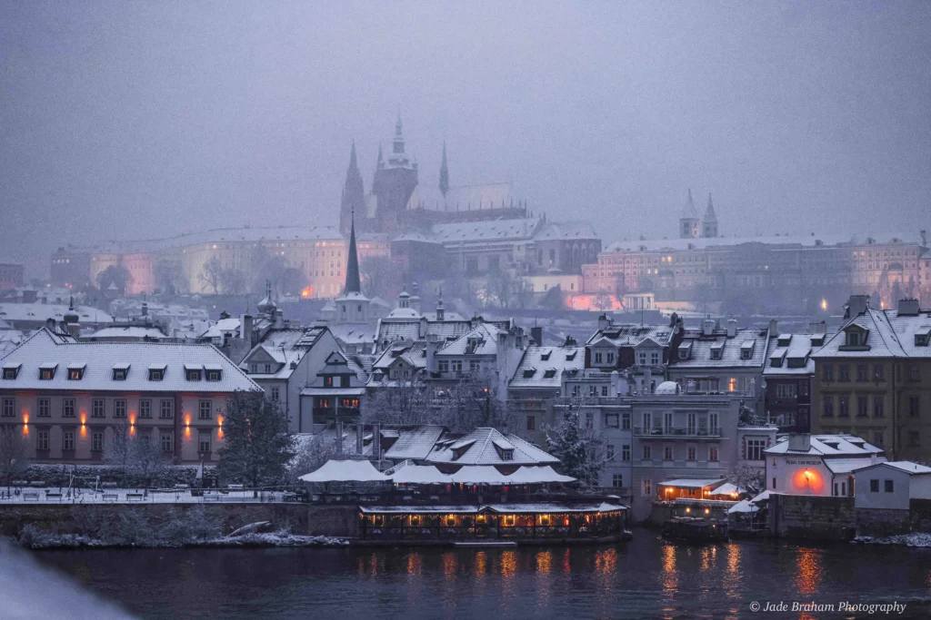 A weekend in Prague and you're standing on the bridge looking at the city covered in snow. 