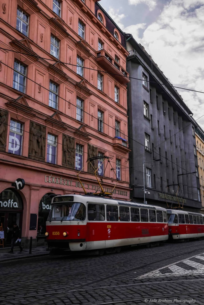 There are many red and white trams in Prague.