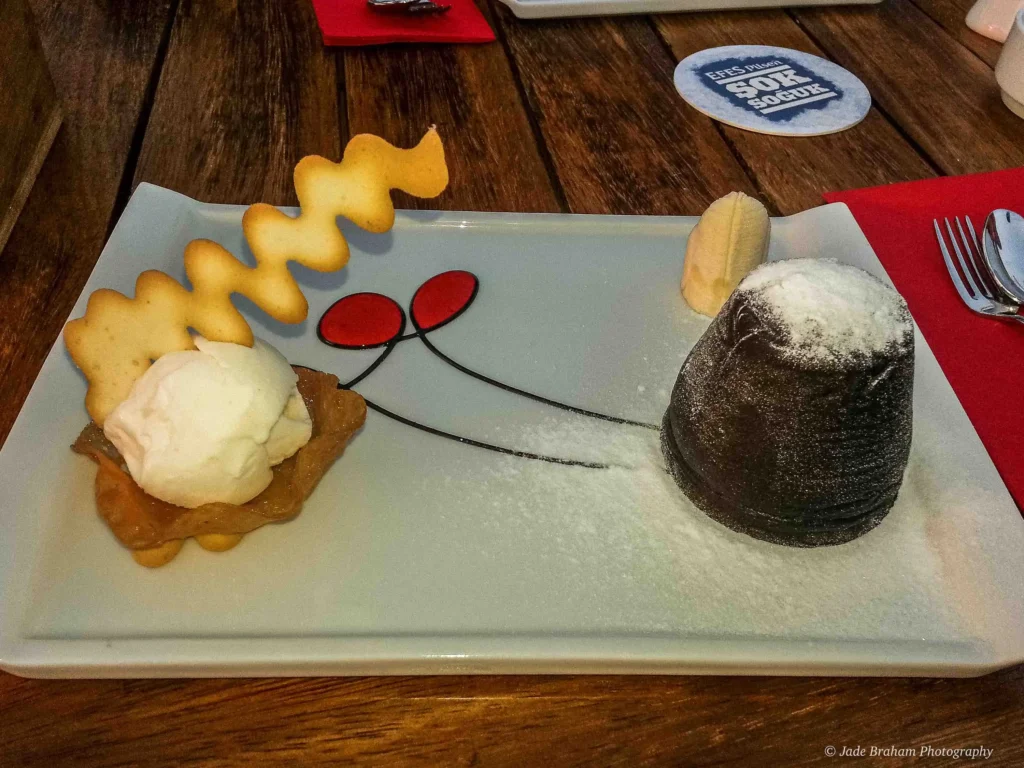 A chocolate fondant and vanilla ice cream.