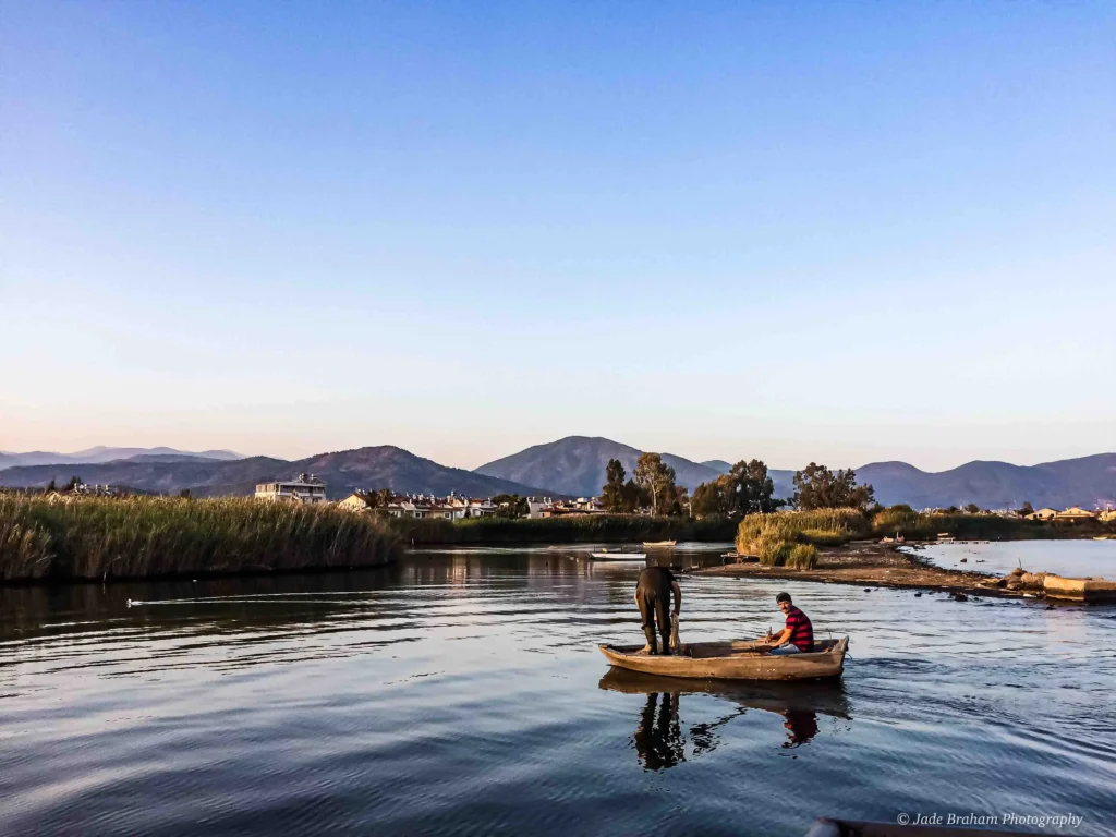 There are two men fishing. 