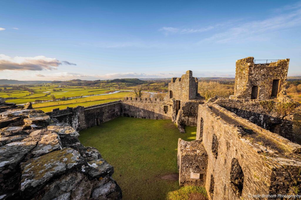 Dinefwr Castle's medieval walls are shining in the sunlight. 