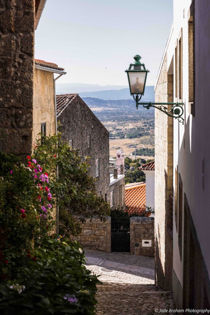 Many of the narrow streets in Monsanto Village in Portugal has flowers. 