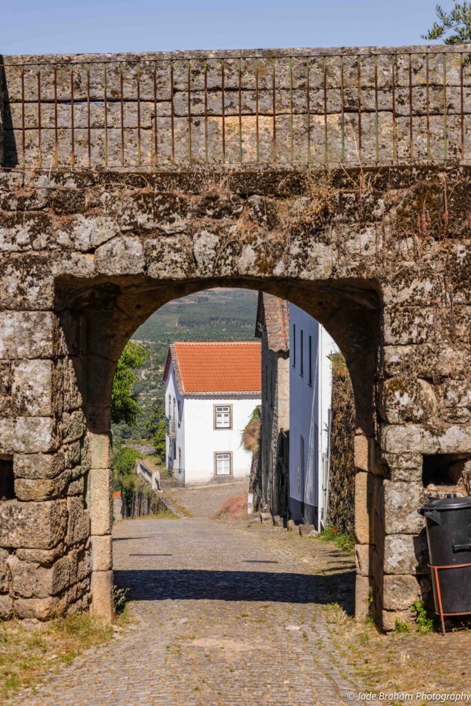 There are many stone arches in Monsanto Village.