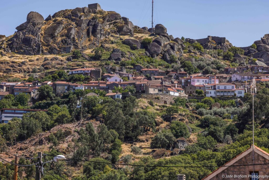 The Monsanto Village in Portugal is sits on a large hill, surrounded by enormous boulders and rocks. 