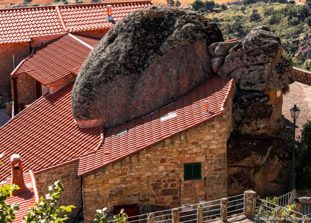 Some of the houses in Monsanto Village have large boulders for roofs. 