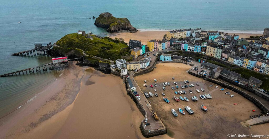 A drone shot of Tenby harbour, beaches and old zoo. 