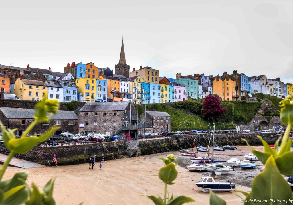 Tenby Harbour is overlooked by multi-coloured Georgian houses. 